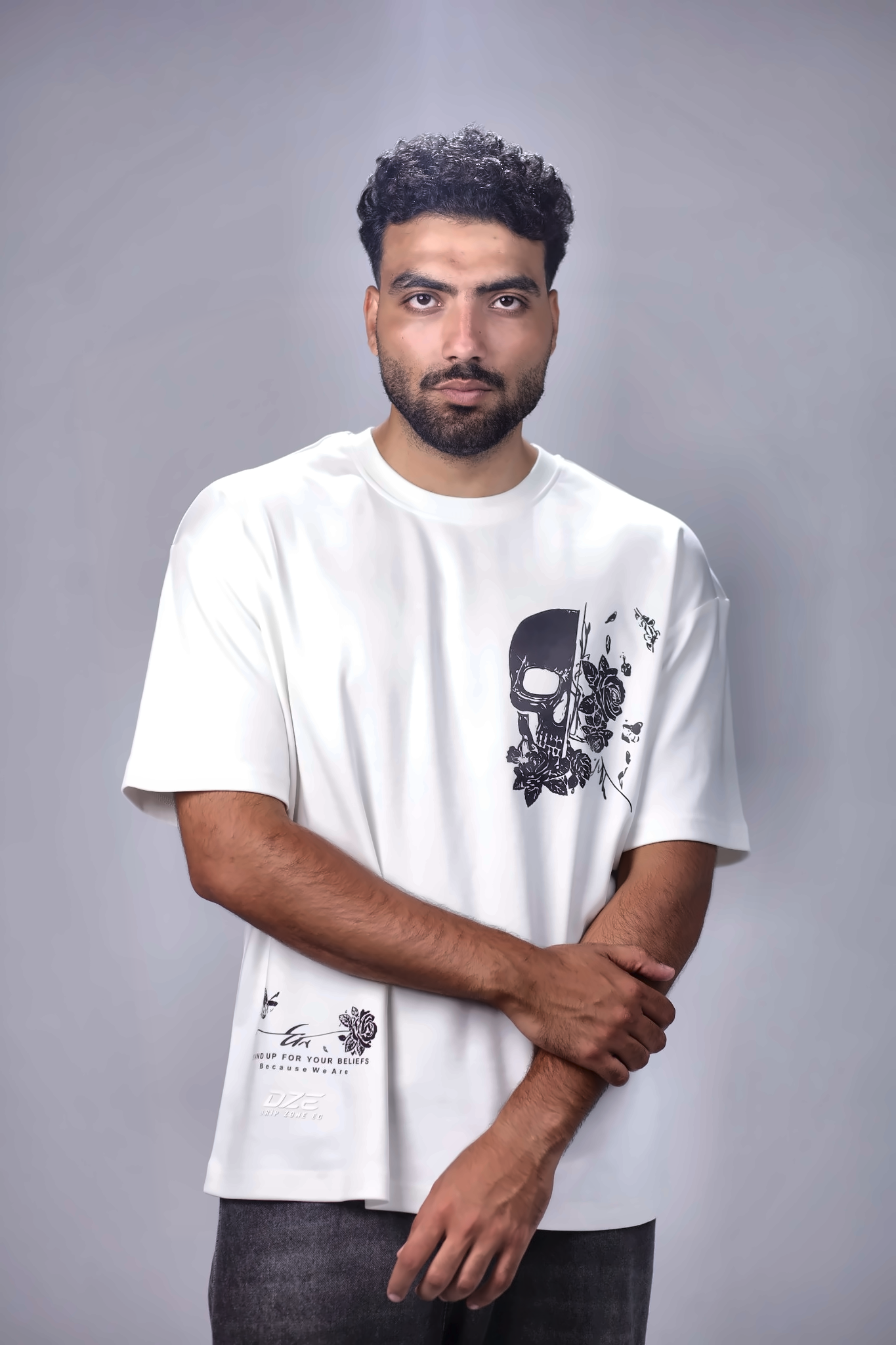 oversized heavyweight cotton T-shirt featuring a skull and floral graphic on the front.